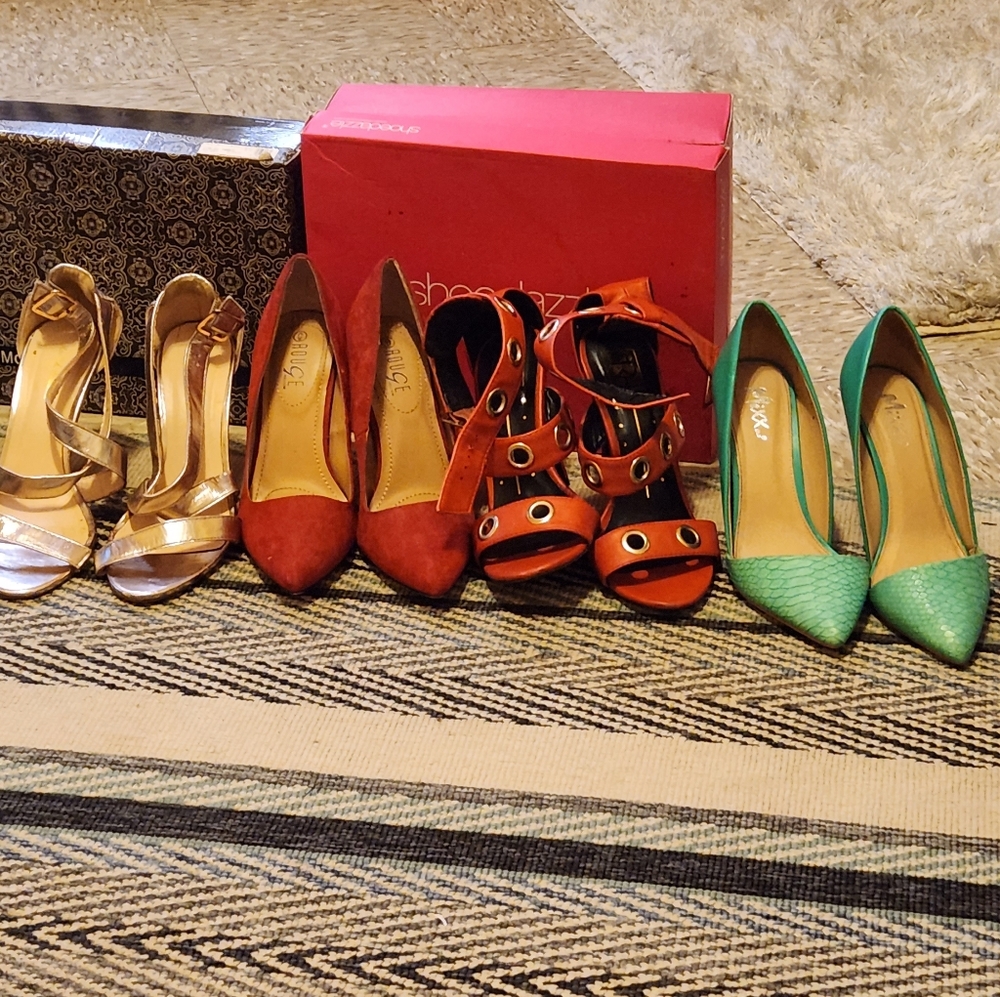 They are some pair of heels red,green, black,white and gold rose